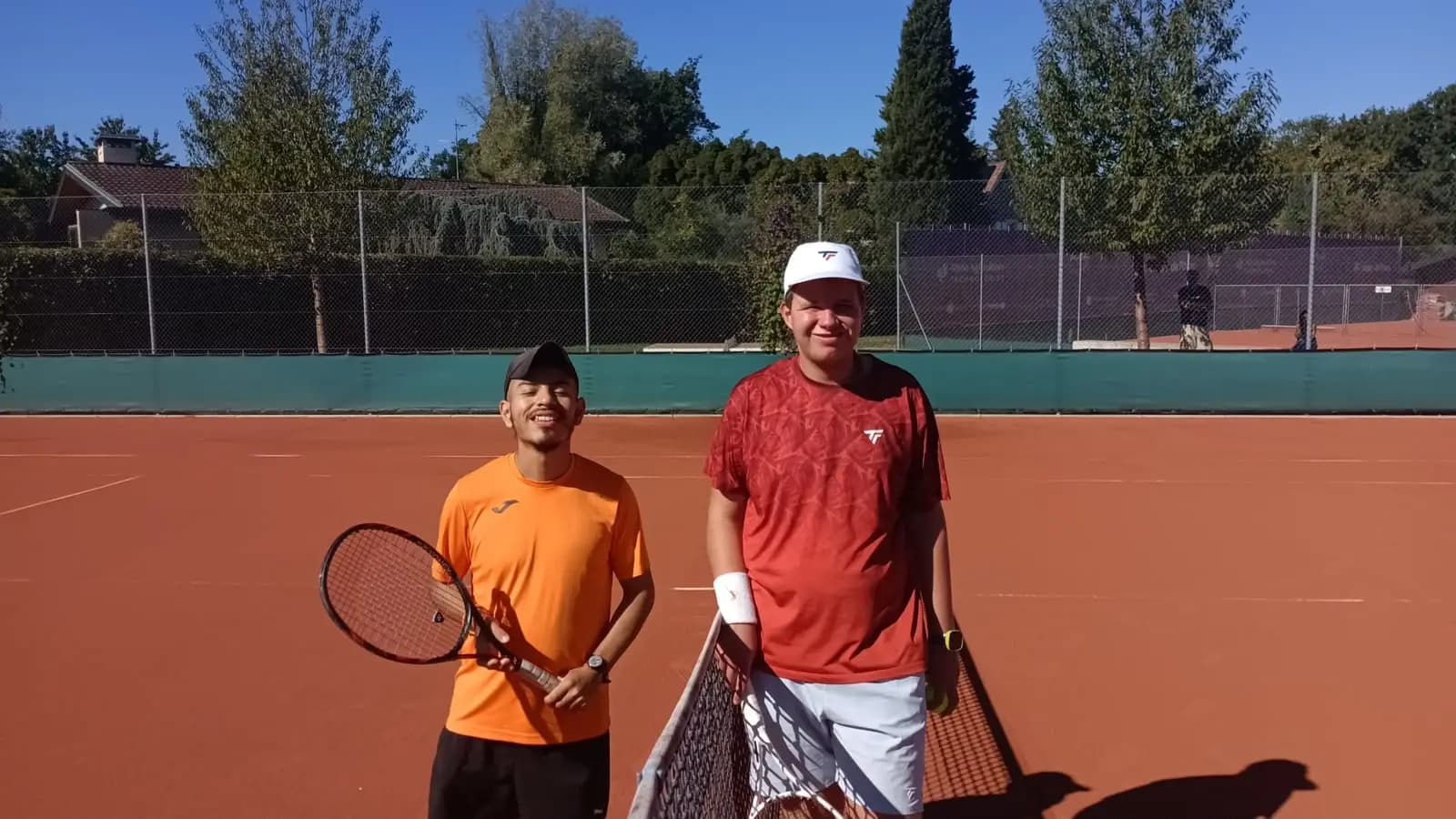 Two players from the singles – intellectual disability draw on court