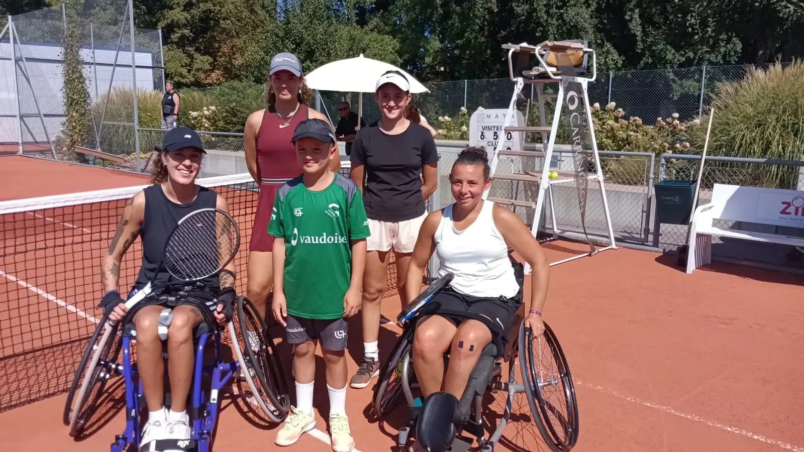 Women wheelchair tennis players and TCCB ball kids